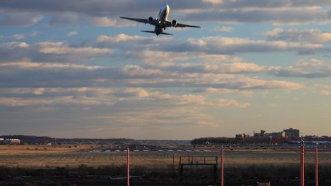 An airplane takes off from a runway in Arlington, Virginia near Washington, D.C. on a late winter afternoon.