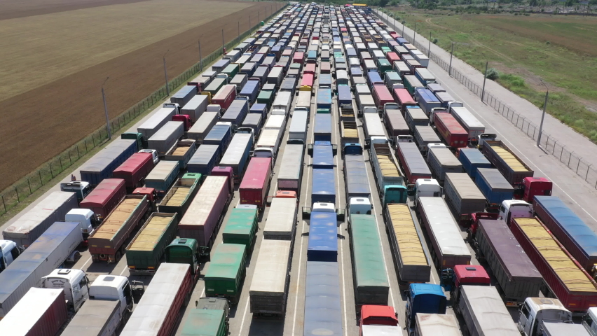 A huge queue of trucks. Traffic jam from trucks. Royalty-Free Stock Footage #1068327845
