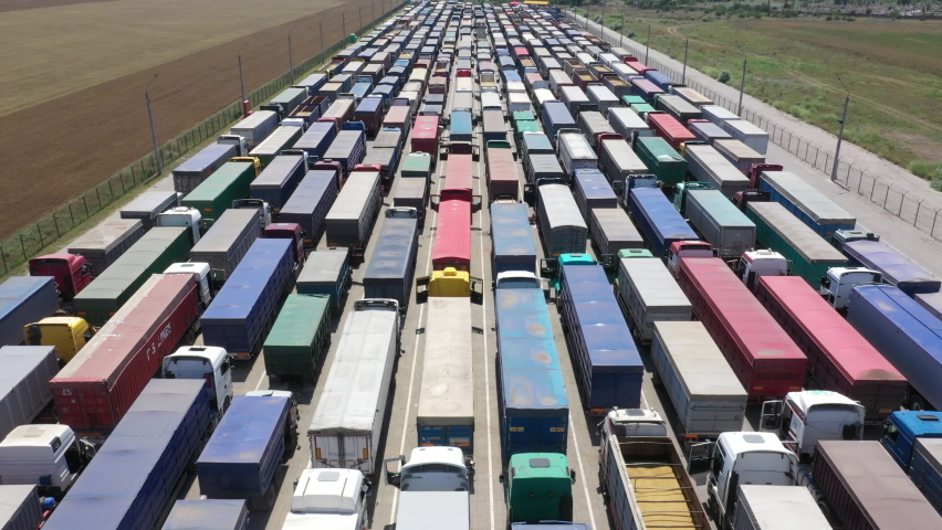 A huge queue of trucks. Traffic jam from trucks. | Shutterstock HD Video #1068327845