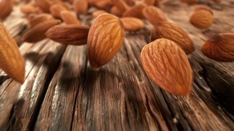 Super Slow Motion Detail Shot of Almonds Rolling Towards on Wooden Background at 1000fps with Camera Motion.