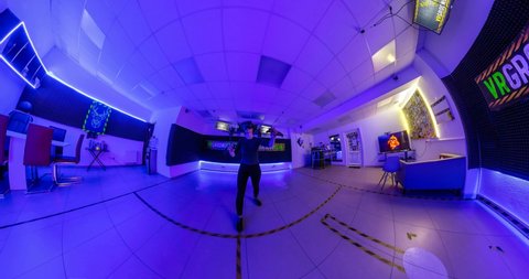 GRODNO, BELARUS -  MARCH 2021: Curvature of space of little planet transformation. Abstract torsion and spinning of panorama in virtual club with neon light