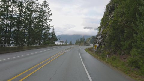 Vancouver, British Columbia, Canada - Jan 16, 2021: Sea to Sky Highway Drive in Howe Sound during a cloudy winter day.