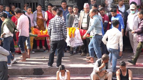 Kathmandu, - Nepal, October 25, 2019: The Burial Ritual cremation ceremony real editorial sound available at Pashupatinath Temple, Kathmandu, Nepal