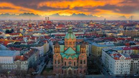 Munich skyline drone hyperlapse video at sunrise, munich city germany view from sky downtown church and old town.