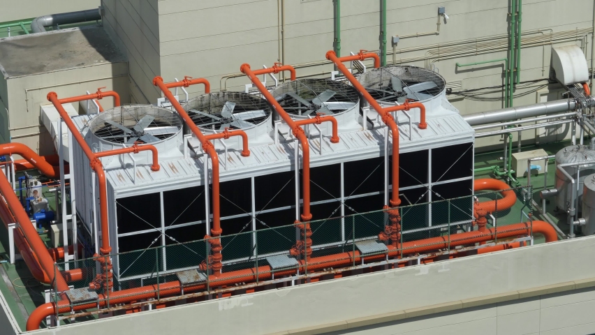 Heating, ventilation and air conditioning (HVAC). Industrial ventilation system on roof of skyscraper or high buildings. Fan turns in protective casing