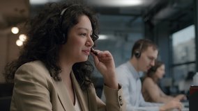 Call center and helpful customer service. Use pc computer and answer questions on phone line at modern co-working. Diverse group of people talks on sale hotline. Busy seller at agency office indoors - Powered by Shutterstock - Get 15% off with code: PIKWIZARD15