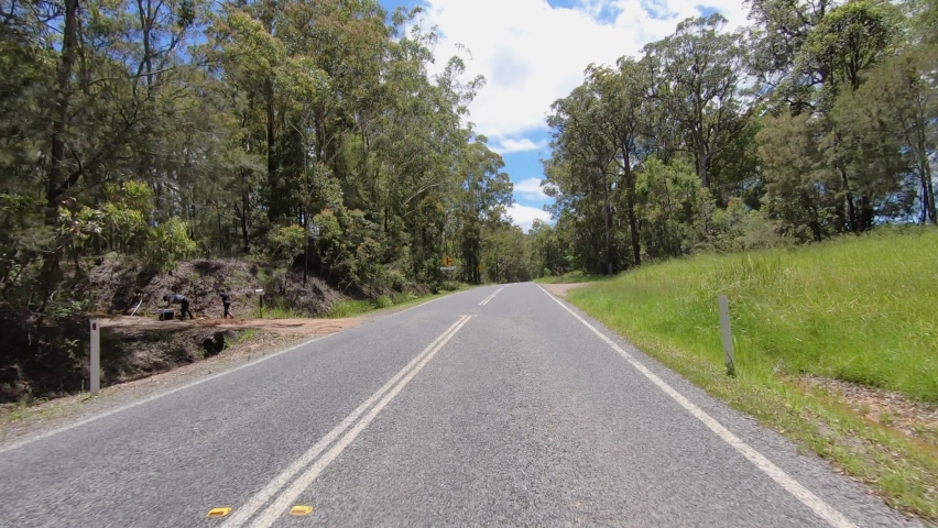 Rear facing driving point of view POV of a deserted Queensland country road with telegraph poles and blude sky - ideal for interior car scene green screen replacement | Shutterstock HD Video #1068366521
