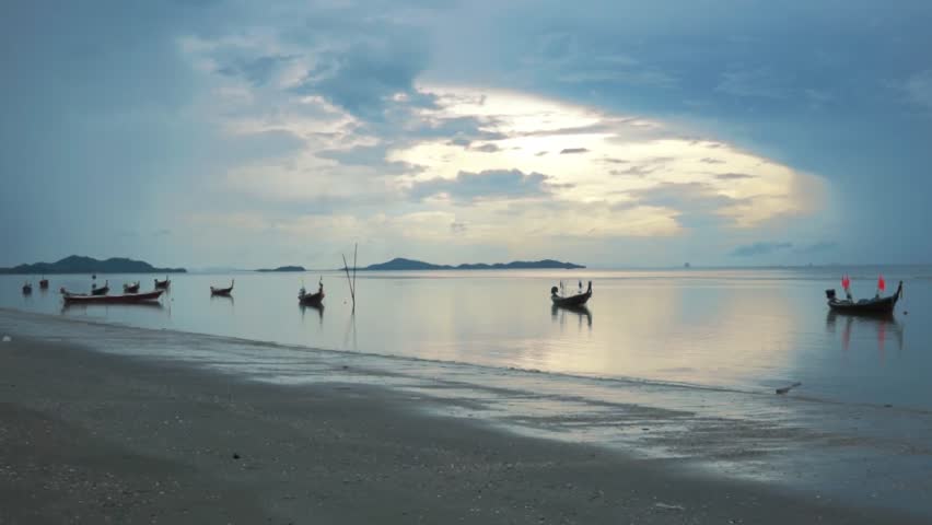 Group of Boats moor on the beach, before sunset
