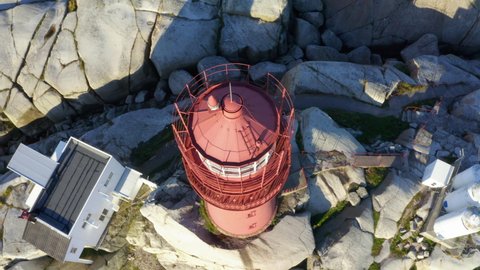 Svenner Lighthouse, drone footage top down, tilted movement revealing lighthouse