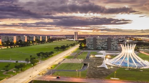 Brasilia - DF - Brazil - FEB 15 2021 - Esplanade of ministries in the Federal District, Architect: Oscar Niemeyer, sunrise with lake in the background, hyperlapse drone motion up and sideways