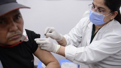 New Delhi, India, March 3 2021:healthcare worker getting vaccine shot during the second phase of Covid-19 vaccination drive.