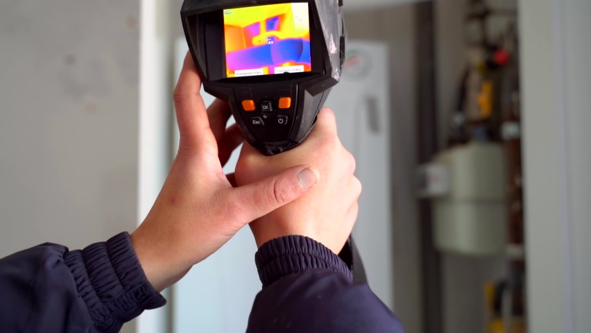 Inspection of enclosing structures inside the premises with a thermal imager. 4k | Shutterstock HD Video #1068395609