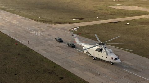 Transport helicopter Mi-26 TC loading cars, aerial view. (NATO codification: Halo) heaviest multipurpose transport helicopter in the world.