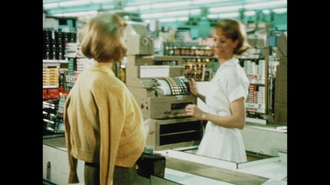 1960s: cashier giving customer change, cashier scanning and pricing items