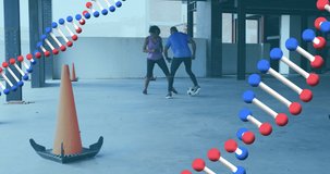 Animation of two dna strains spinning over man and woman playing football. Digital interface global sport and performance concept digitallygenerated video.
