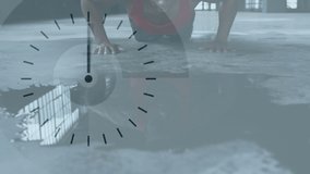 Animation of clock ticking over man doing push ups in an abandoned building. Digital interface global sport and performance concept digitallygenerated video.