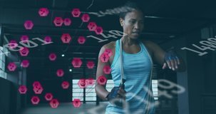 Animation of medical icons and numbers changing over woman with jumping rope taking break. Digital interface global sport and performance concept digitally generated video.