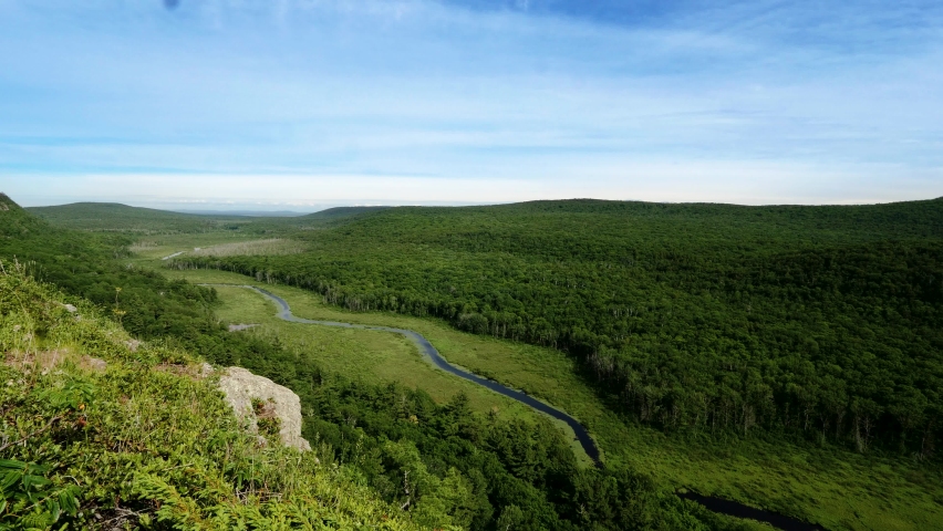 Small river flowing though a mountain valley. Overlook from Porcupines Mountains State Park Michigan