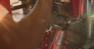 Animation of hands of barista frothing milk using machine at a cafe. independent business concept, digitally generated video.