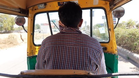 Baroda, India-03 03 2021: AutoRickshaw\Tuk Tuk\Indian trasportation vehicle option ride on a sunny day, All cities like Jaypur\Jaipur, Pune, Surat, Kolkata, Vadodara, Rajkot have rickshaws.