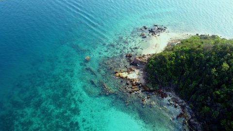 4K video footage of Aerial view or top view from drone camera of beautiful green blue sea wave rock beach in island,Koh larn,Pattaya city Thailand,seascape and nature background relaxing
