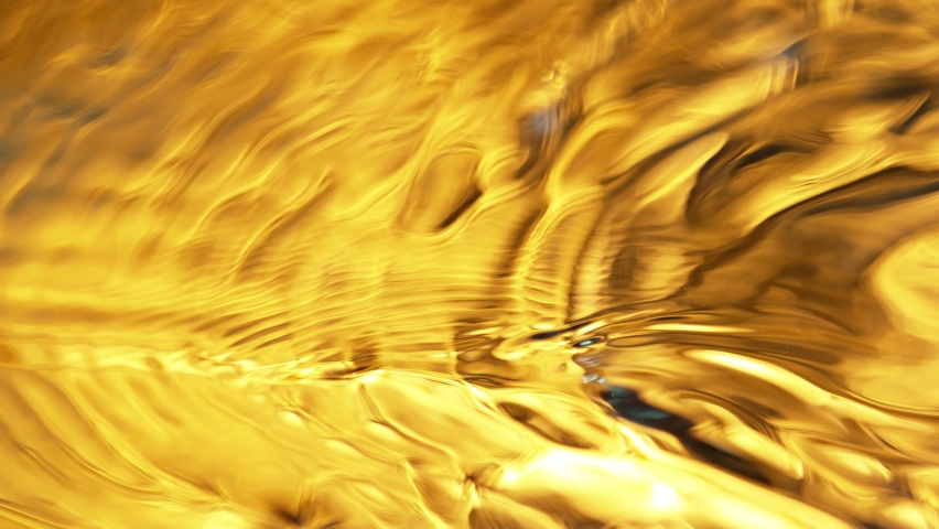 Super Slow Motion Shot of Waving Golden Liquid Luxury Background at 1000fps. Royalty-Free Stock Footage #1068428879