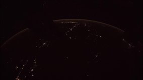 Beautiful 4K time lapse of Earth seen from space through a fish eye lens. Shot at night. Image courtesy of NASA.