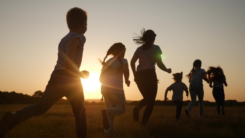 Children happy family kid together run in the park at sunset silhouette. people in the park concept. mom daughter and son joyful run. happy family and little fun baby child summer kid dream concept | Shutterstock HD Video #1068440693
