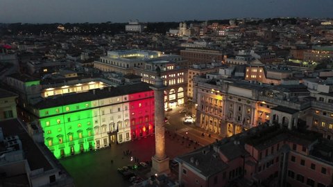 at night, Palazzo Chigi in Rome, seat of the Italian government. The tricolor of the Italian flag illuminates the facade. Center city of Roma, Italy.