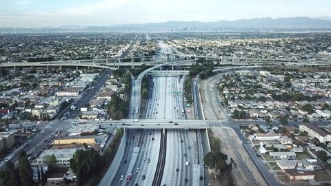 Drone 4k. Aerial view of freeway Los Angeles downtown. Cars drive on highway roads in LA. urban modern city in California, America.