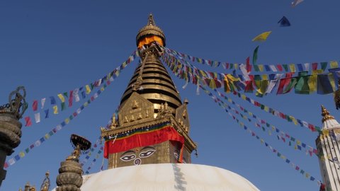 Colorful Monkey Temple Swayambhunath Stupa and UNESCO World Heritage Site in Kathmandu Valley, Nepal with Golden Top Eye and Prayer Flags