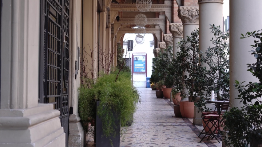 Architectural landmark with large columns and pot plants
