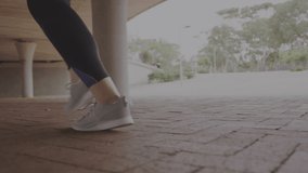 Animation of hello text over woman jogging in background. global technology, video game and connection concept digitally generated video.