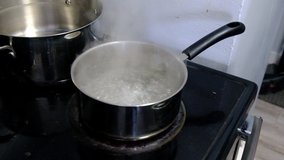 Boiling gnocchi in a large steel pan. A traditional italian food
