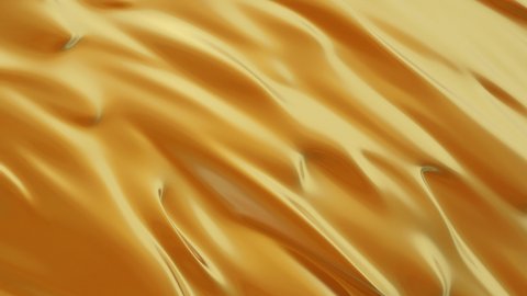 Abstract gold liquid. Golden wave background. Gold background. Gold texture. Lava, nougat, caramel, amber, honey, oil.
