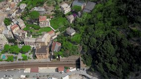 Panorama view of Monterosso al Mare village one of Cinque Terre in La Spezia,Italy.Panoramic drone view of railway and village. View on architecture of old italian village.Video 4K