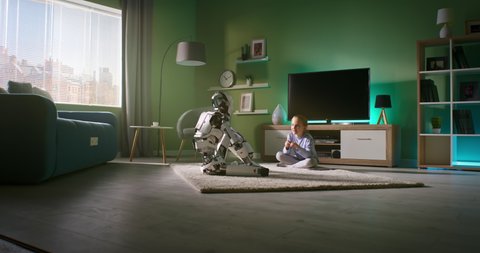 Zoom in view of girl sitting on carpet near TV set and talking with android robot while resting at home in weekend