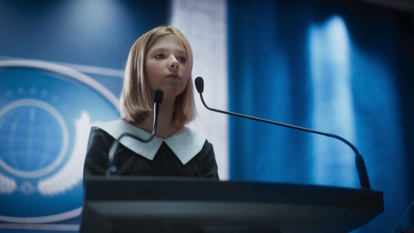 Portrait of an Young Girl Activist Delivering an Emotional and Powerful Speech at a Press Conference in Government Building. Child Speaking to Congress at Summit Meeting with World Leaders. | Shutterstock HD Video #1068497840