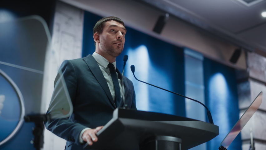 Portrait of an Young Organization Representative Speaking at Press Conference in Government Building. Press Officer Delivering a Speech at Summit. Minister Speaking at Congress Hearing. | Shutterstock HD Video #1068497861