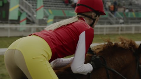 Jockey Sportswoman Riding Horse Animal in Race