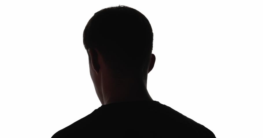 Doubtful man silhouette. Future opportunity. Ambition motivation. Tomorrow perspective. Dark outline of confused guy looking back forward in flicker light isolated on white copy space background. Royalty-Free Stock Footage #1068503759