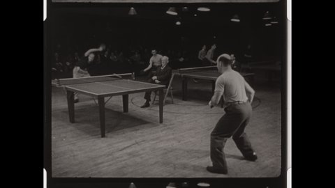 1950s Budapest, Hungary. Men compete in World Table Tennis Championships, or Ping Ping Tournament. 4K Overscan of Vintage Archival 16mm Film Print  