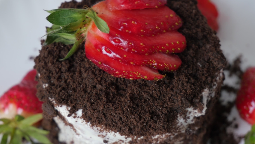 Chocolate chips on the cake. Sweet breakfast, unhealthy food. Sugar food. Juicy ripe strawberries.
Summer berries. 4K