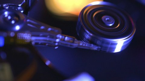 close-up view of working, opened hard disk drive (looping)