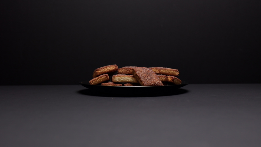Appetizing Butter Cookies With Sprinkled Sugar On Black Plate On Black Background. Zoom In Dolly Slider Shot