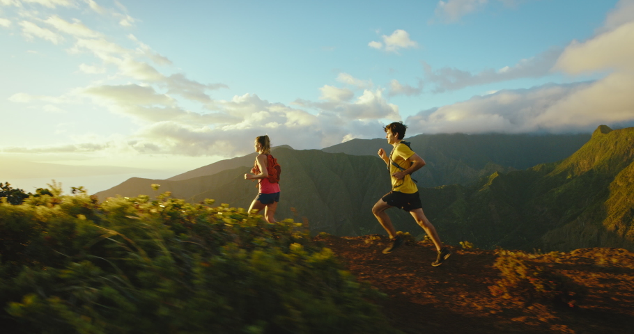 Running on mountain trail at sunset, epic adventure, healthy fitness lifestyle, training for marathon | Shutterstock HD Video #1068525917
