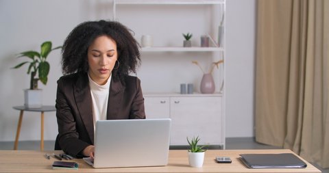 Young afro american business woman curly girl student freelancer receives email with bad results medical tests refusal from new job reads negative news looking into laptop feeling frustrated stress