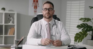 Doctor is consulting a patient in video chat. healthcare service worker talking to a patient and gesturing - online medicine, health and safety 4k footage