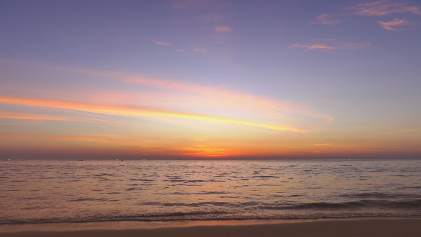 4k Scene of sunset tropical beach sea. New normal after covid-19. Phuket Thailand beautiful tropical beach with sunset sky. Beautiful Phuket beach is famous tourist destination at Andaman sea summer | Shutterstock HD Video #1068532850