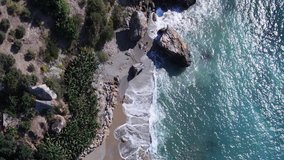 Sea near the coast - aerial view of the coastal seascape. Vertical video